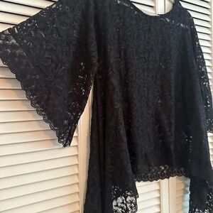 NWOT black lace top. Size medium, runs big